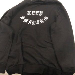 H&M “Keep Smiling” crewneck sweater
